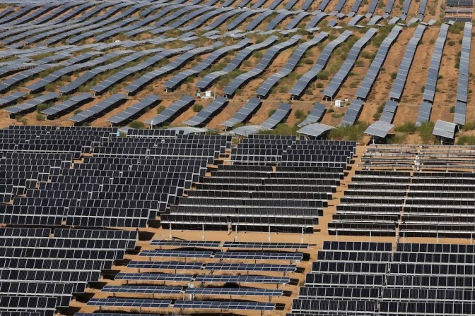 Solar panels producing excess electricity while a power grid struggles to absorb renewable energy