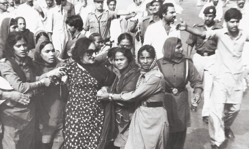 Pakistani police personnel arresting women political activists during an anti-dictatorship rally.